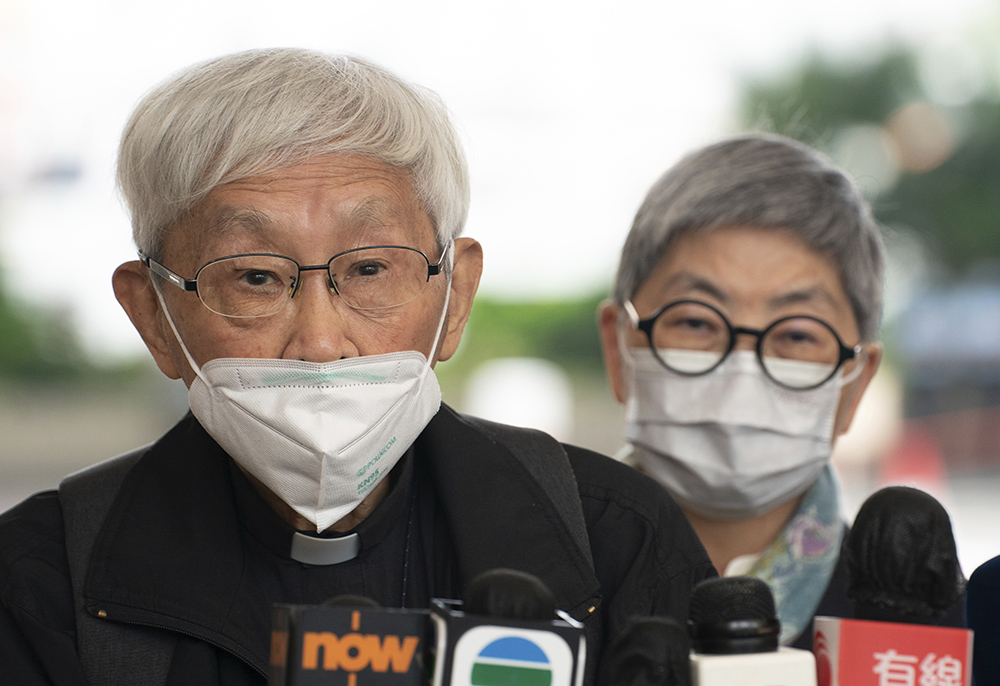 Cardinal Joseph Zen, left, speaks to the media at the West Kowloon Magistrates Courts after the verdict session in Hong Kong Nov. 25. The 90-year-old Catholic cardinal and five others in Hong Kong were fined after being found guilty of failing to register a now-defunct fund that aimed to help people arrested in widespread protests three years ago. (AP/Anthony Kwan)